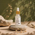 Lumeya Donkey Milk Face Serum bottle on a stone surface with natural elements